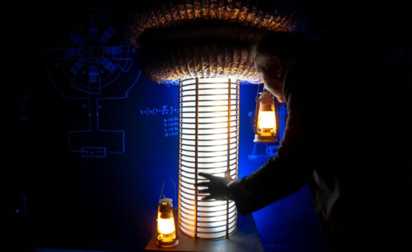 Tesla-themed escape room at Fox in a Box Adelaide with vintage lab equipment, copper wires, and steampunk-style control panels.