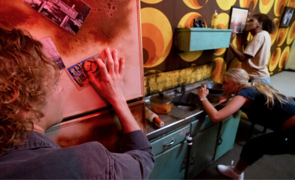 Zodiac Killer escape room at Fox in a Box Adelaide featuring dark lighting, eerie props, and crime investigation-themed décor.