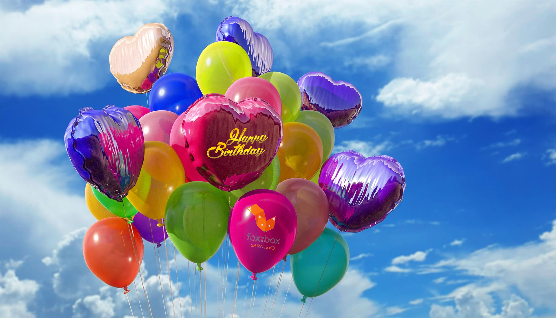 Colorful birthday balloons in red, yellow, blue, and green, celebrating parties and events at Fox in a Box Adelaide.